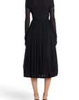 Lost Labels vintage black pleated nylon evening gown with long sheer sleeves, back view