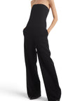 Lost Labels black strapless wide-leg tailored jumpsuit with side pockets on a model against a white background