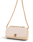 Lost Labels Chanel quilted beige leather handbag with gold chain strap and iconic CC turn-lock closure