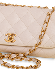 Lost Labels beige quilted leather Chanel bag with gold-tone chain strap and iconic CC turn-lock closure