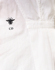 Lost Labels Christian Dior white cotton long-sleeve dress featuring an embroidered bee and CD logo detail