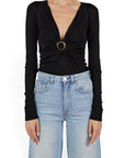 Lost Labels Gucci black long sleeve top featuring a deep V-neck and a gold buckle detail on a model