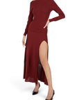 Lost Labels Jacquemus burgundy maxi dress in cotton blend with long sleeves and a high side slit on a model