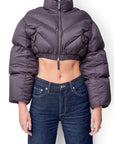 Lost Labels Khaite cropped puffer jacket in dark grey with a high collar, zip front, and chevron quilting.