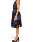 Lost Labels Nina Ricci silk dress in blue and black with a fluid drape and sheer paneling, side view.