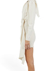 Lost Labels off-white one-shoulder mini dress with crystal-embellished ring accents and long sleeve, side view