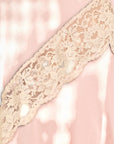 Lost Labels vintage blush pink nylon dress featuring intricate cream lace trim detailing on the bust.