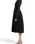 Lost Labels vintage black pleated nylon evening gown with long sheer sleeves, side view