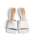 Lost Labels Bottega Veneta white leather mules with a square-toe silhouette and sculpted stiletto heel.