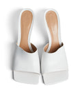 Lost Labels Bottega Veneta white leather square-toe mules with sculpted stiletto heels on a white background.