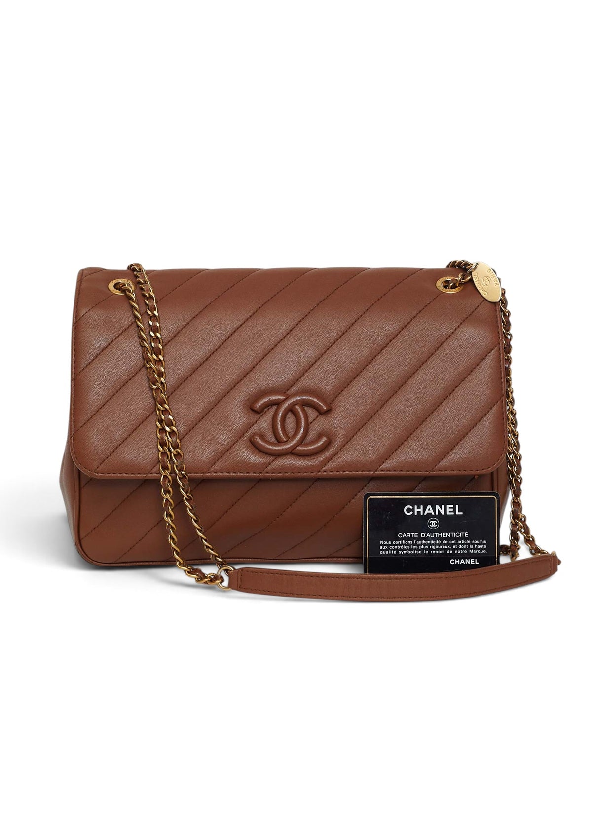 Lost Labels brown leather Chanel flap bag with diagonal quilting, gold chain strap, and authenticity card.