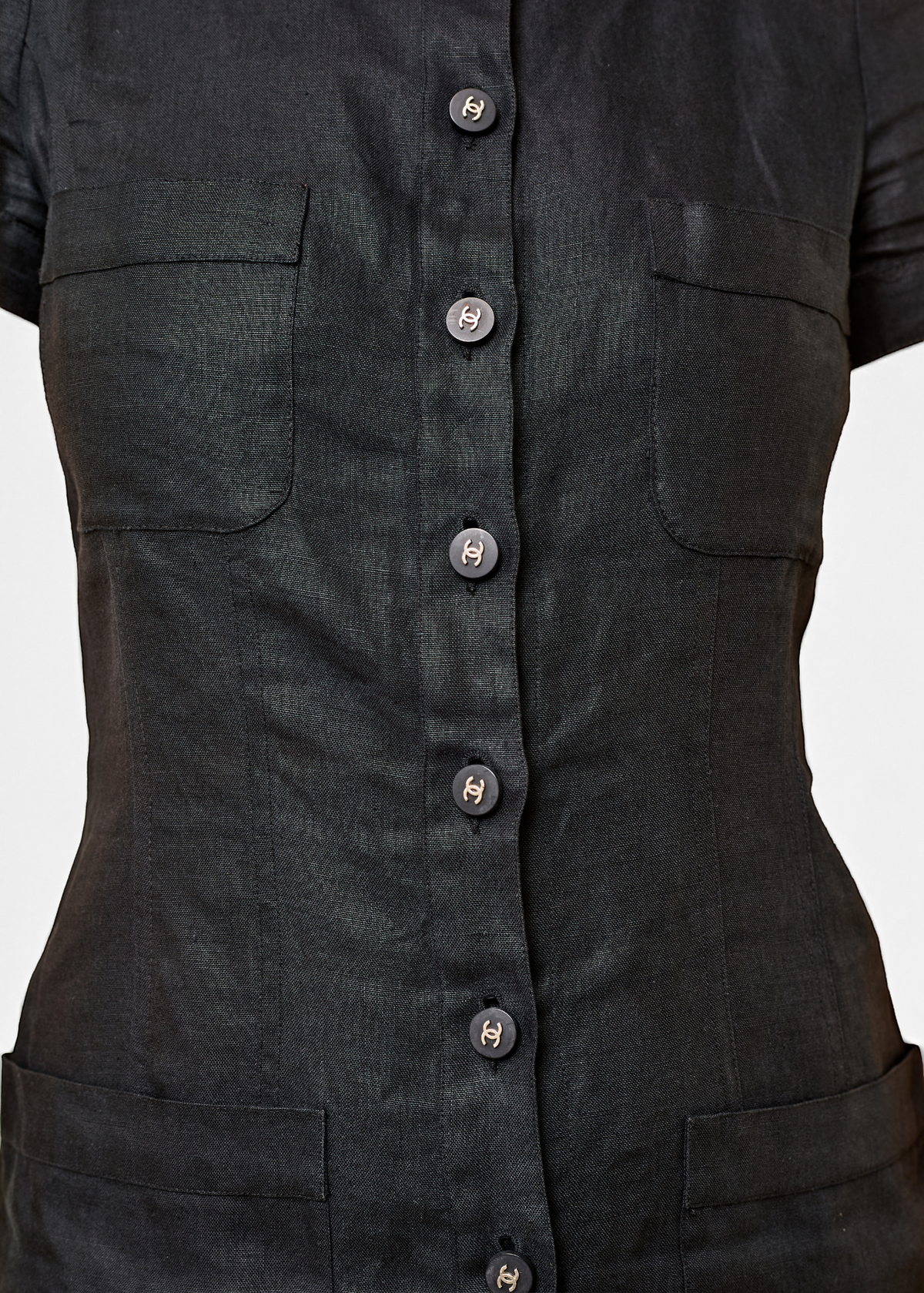 Lost Labels black linen Chanel midi dress featuring a button-down front with signature CC logo buttons and pockets.