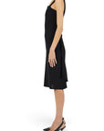 Lost Labels Chanel Boutique black midi wrap dress with a tailored silhouette worn by a model in side profile view