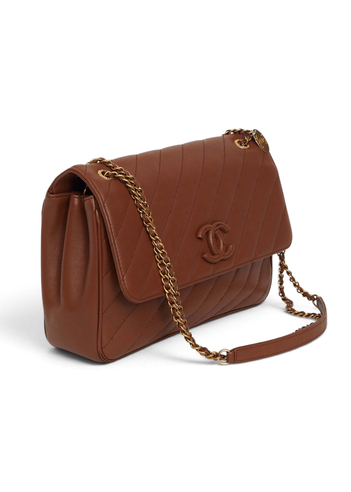 Lost Labels brown leather Chanel flap bag with diagonal quilting, gold chain strap, and signature CC logo.