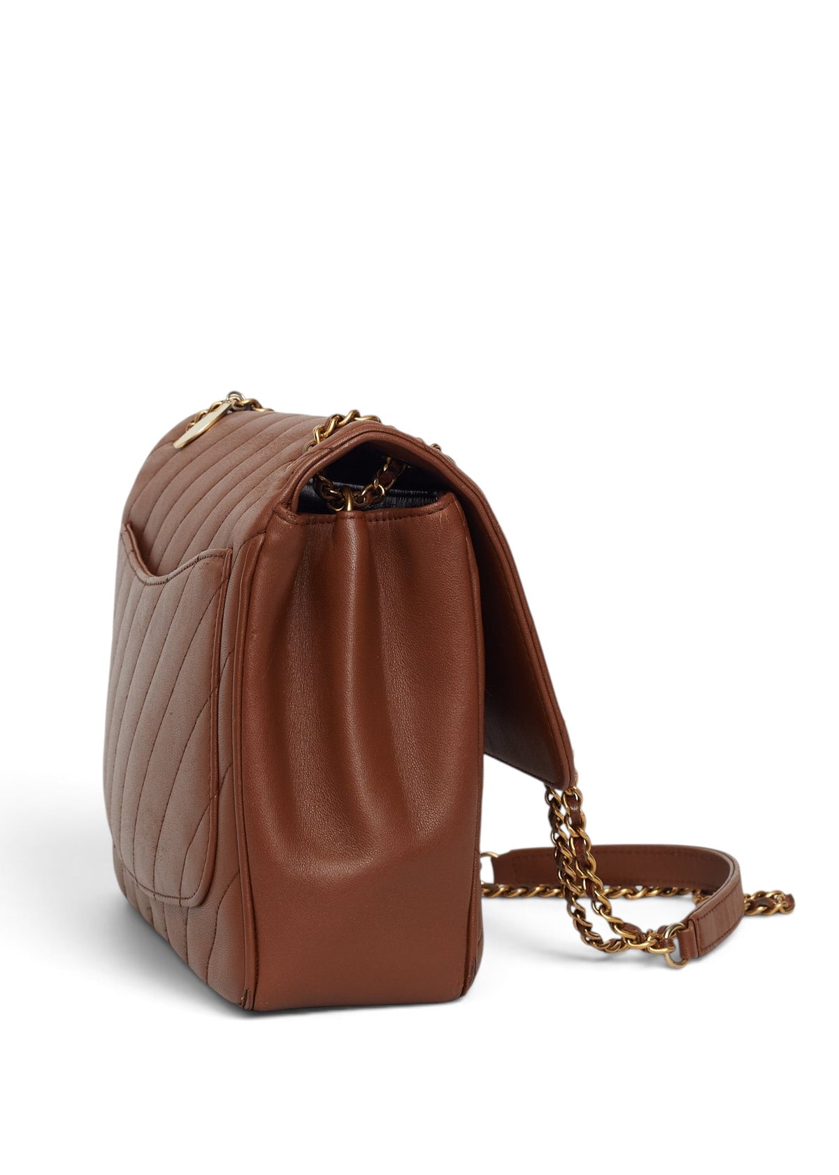 Lost Labels Chanel brown leather flap bag with diagonal quilting and gold chain strap, side view.