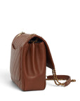 Lost Labels Chanel brown leather flap bag with diagonal quilting and gold chain strap, side view.