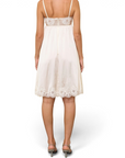 Lost Labels Christian Dior white silk mid-length dress with delicate lace trim worn by a model from the back view.