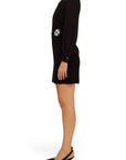Lost Labels Emilio Pucci black mini dress with floral crystal embellishments and long sleeves, side view.