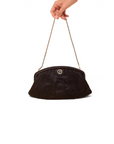 Lost Labels Giorgio Armani black silk clutch bag with a delicate chain strap held by a hand