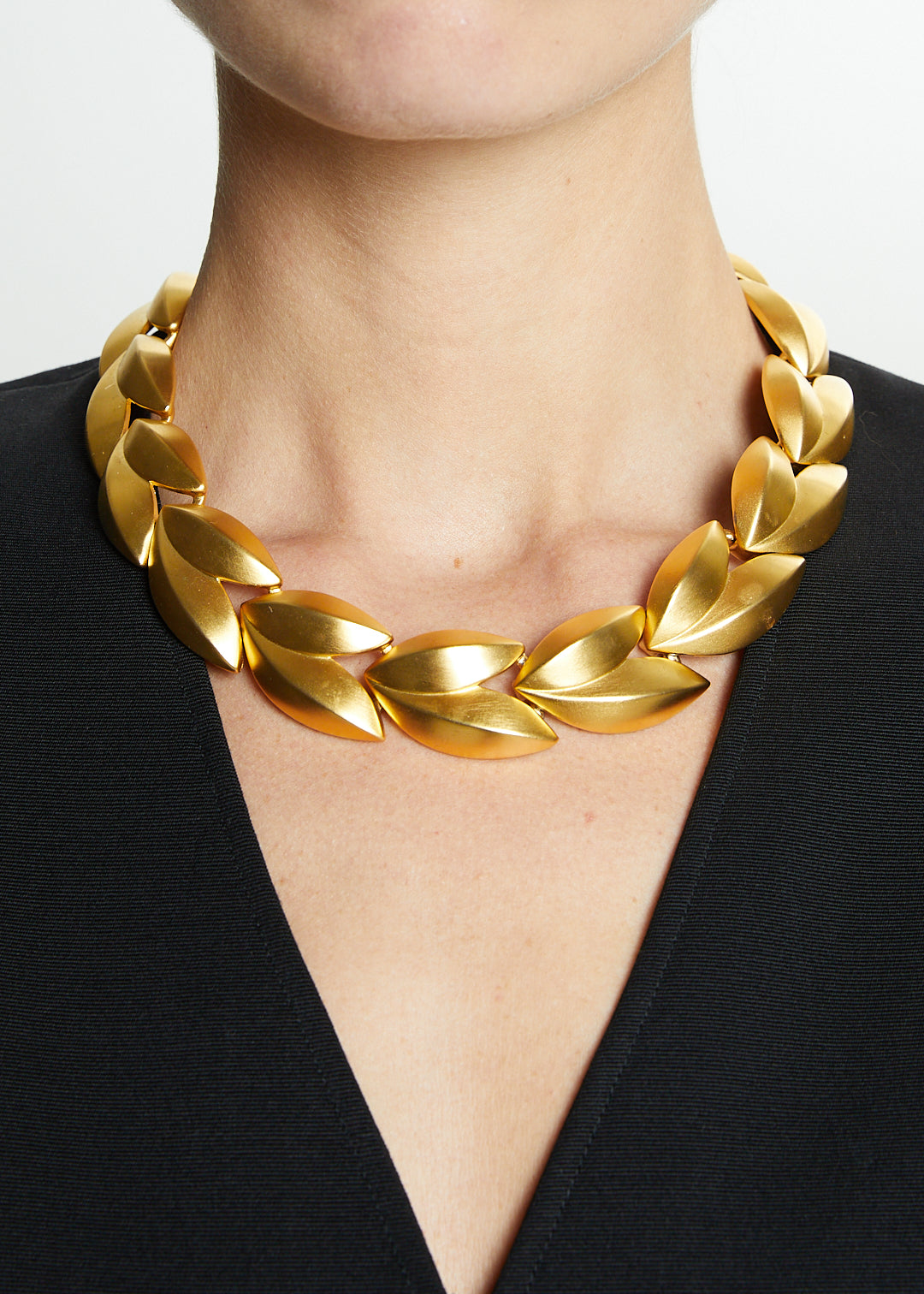 Lost Labels Givenchy statement necklace featuring sculptural brushed gold-tone leaf links in a laurel wreath design.