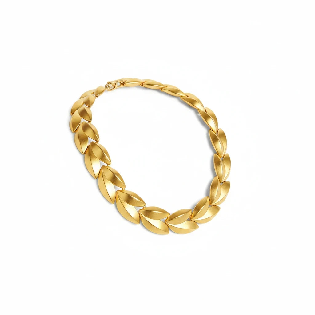 Lost Labels Givenchy statement necklace featuring brushed gold-tone sculptural leaf links and a secure toggle clasp.