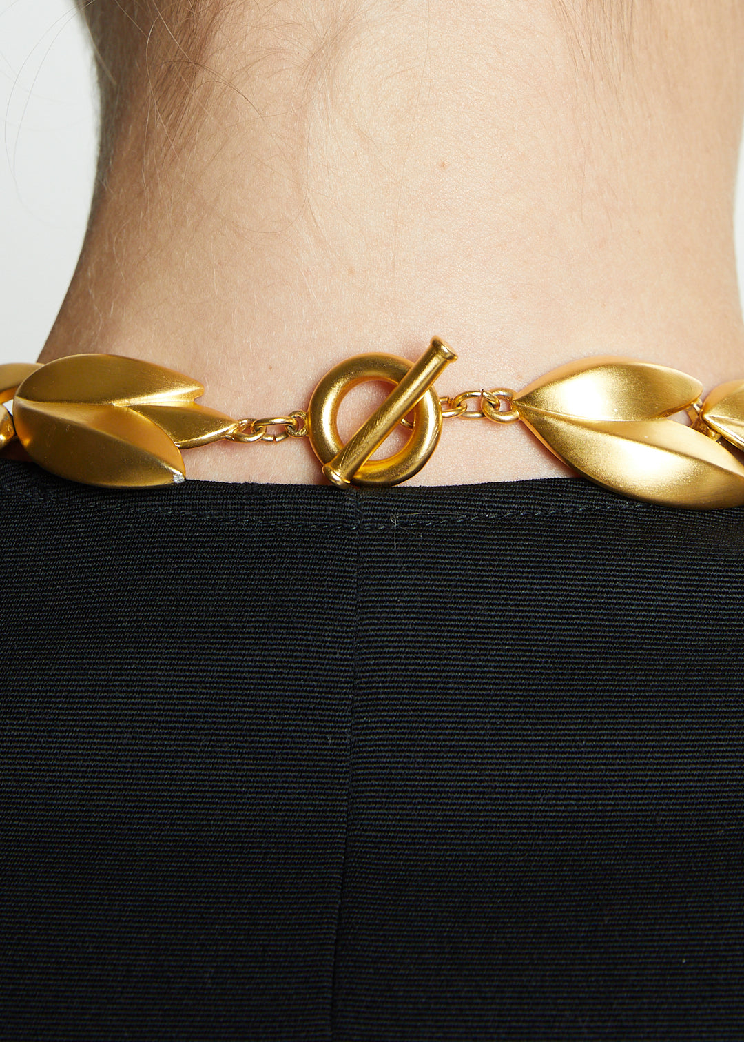 Lost Labels Givenchy statement necklace featuring brushed gold-tone leaf links and a secure toggle clasp closure.