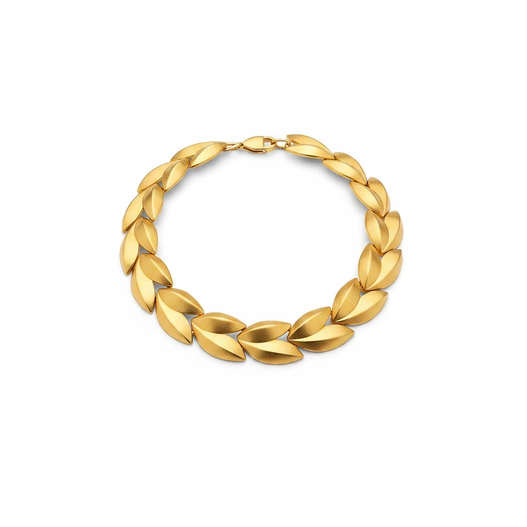Lost Labels Givenchy statement necklace featuring sculptural leaf-inspired links in a brushed gold-tone matte finish.