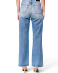 Lost Labels Gucci blue denim jeans featuring a back leather logo patch and straight leg fit on a model