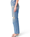 Lost Labels Gucci blue distressed denim jeans with a straight-leg fit worn by a model in gold heeled sandals