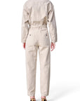 Back view of a beige Isabel Marant Etoile jumpsuit with a belted waist and utility pockets from Lost Labels