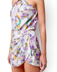 Lost Labels Isabel Marant silk set featuring a floral print halter top and wrap skirt in white, purple, and green.
