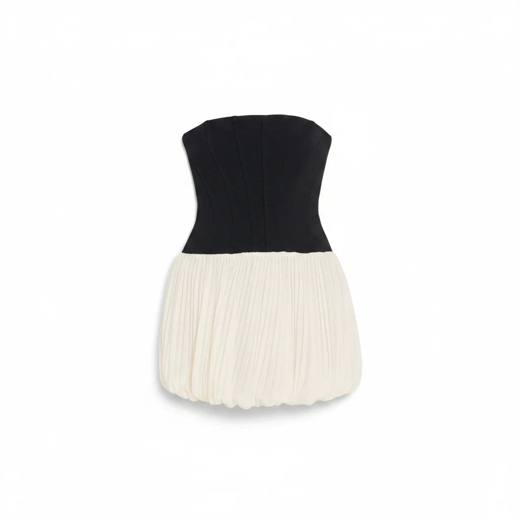 Lost Labels Jonathan Simkhai strapless mini dress with a black corset bodice and a pleated cream bubble skirt.