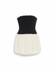 Lost Labels Jonathan Simkhai strapless mini dress with a black corset bodice and a pleated cream bubble skirt.