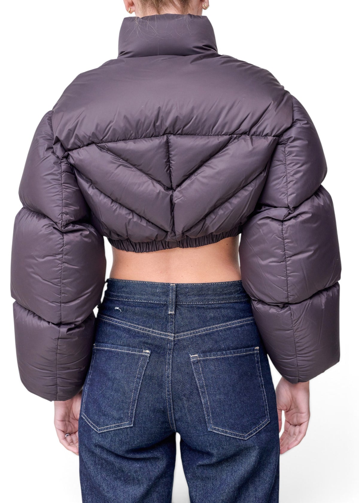 Lost Labels Khaite dark grey cropped puffer jacket with chevron quilting and voluminous sleeves, back view.