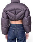 Lost Labels Khaite dark grey cropped puffer jacket with chevron quilting and voluminous sleeves, back view.