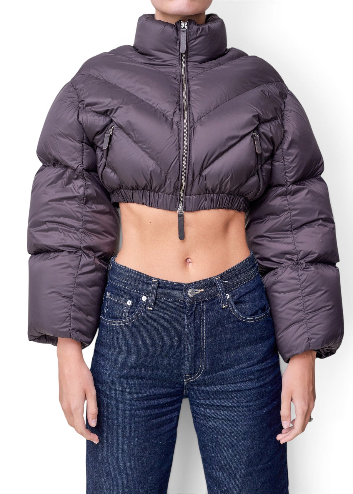 Lost Labels Khaite cropped puffer jacket in dark grey with a high collar, zip front, and chevron quilting.