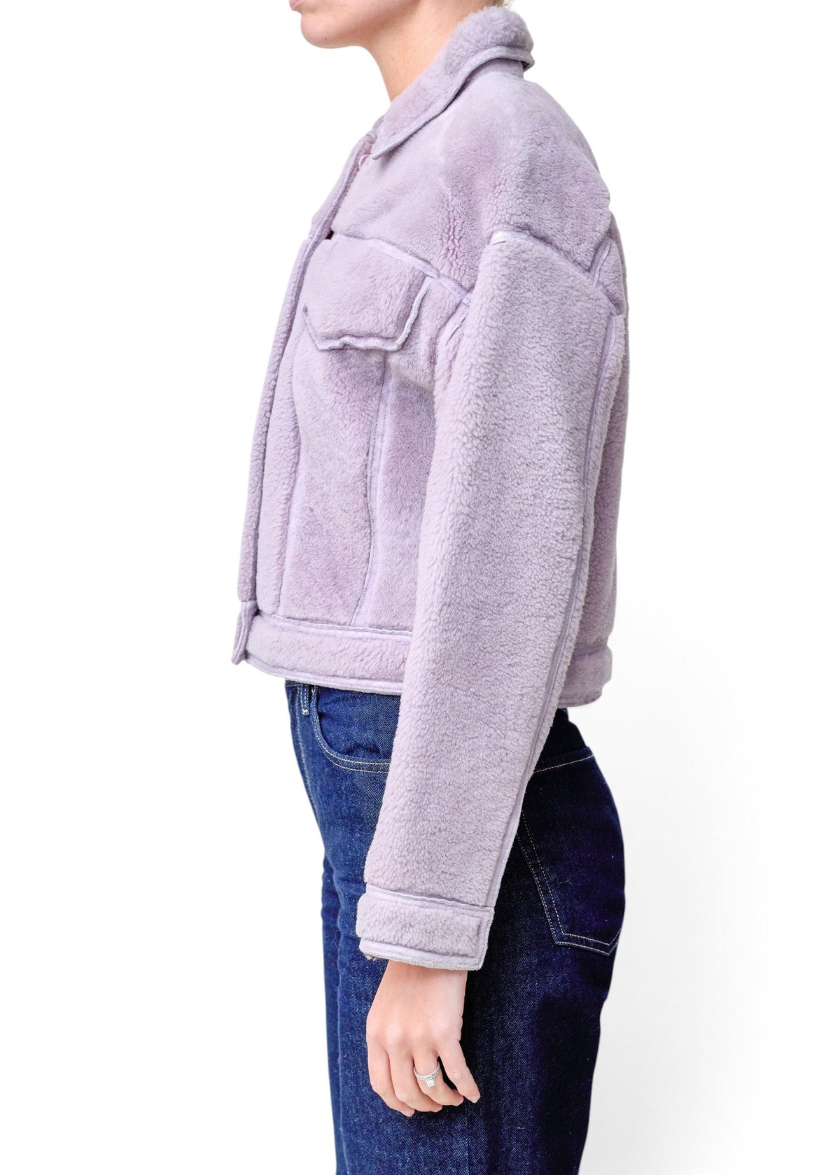 Lost Labels 3.1 Phillip Lim lavender faux shearling cropped jacket with a collar and button front, side view.