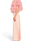 Lost Labels Linni Caro gown in pale pink with a dramatic ruffled bodice and floor-length skirt, side profile view.