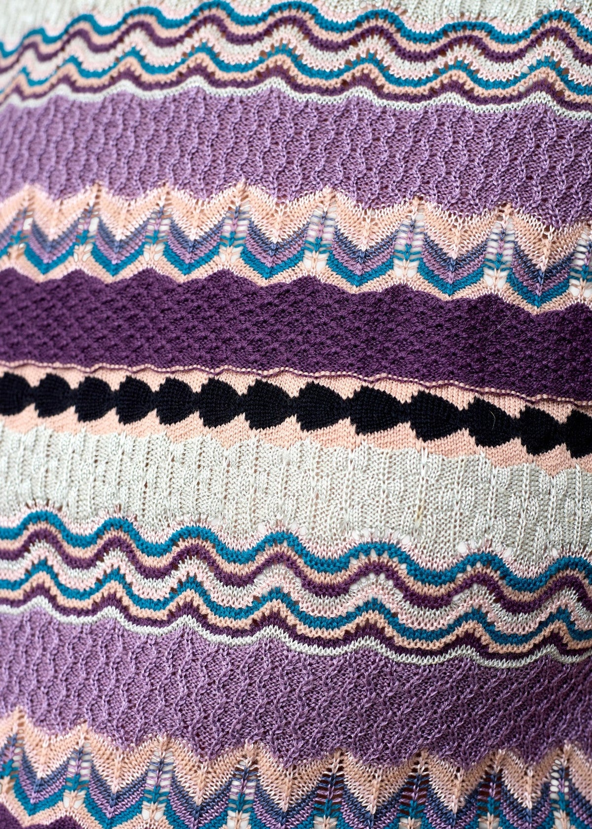 Lost Labels Missoni knit dress featuring a vibrant signature zigzag pattern in shades of purple, pink, and teal.