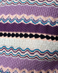 Lost Labels Missoni knit dress featuring a vibrant signature zigzag pattern in shades of purple, pink, and teal.