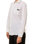 Lost Labels Miu Miu white button-down blouse with a chest pocket and black logo patch worn by a model