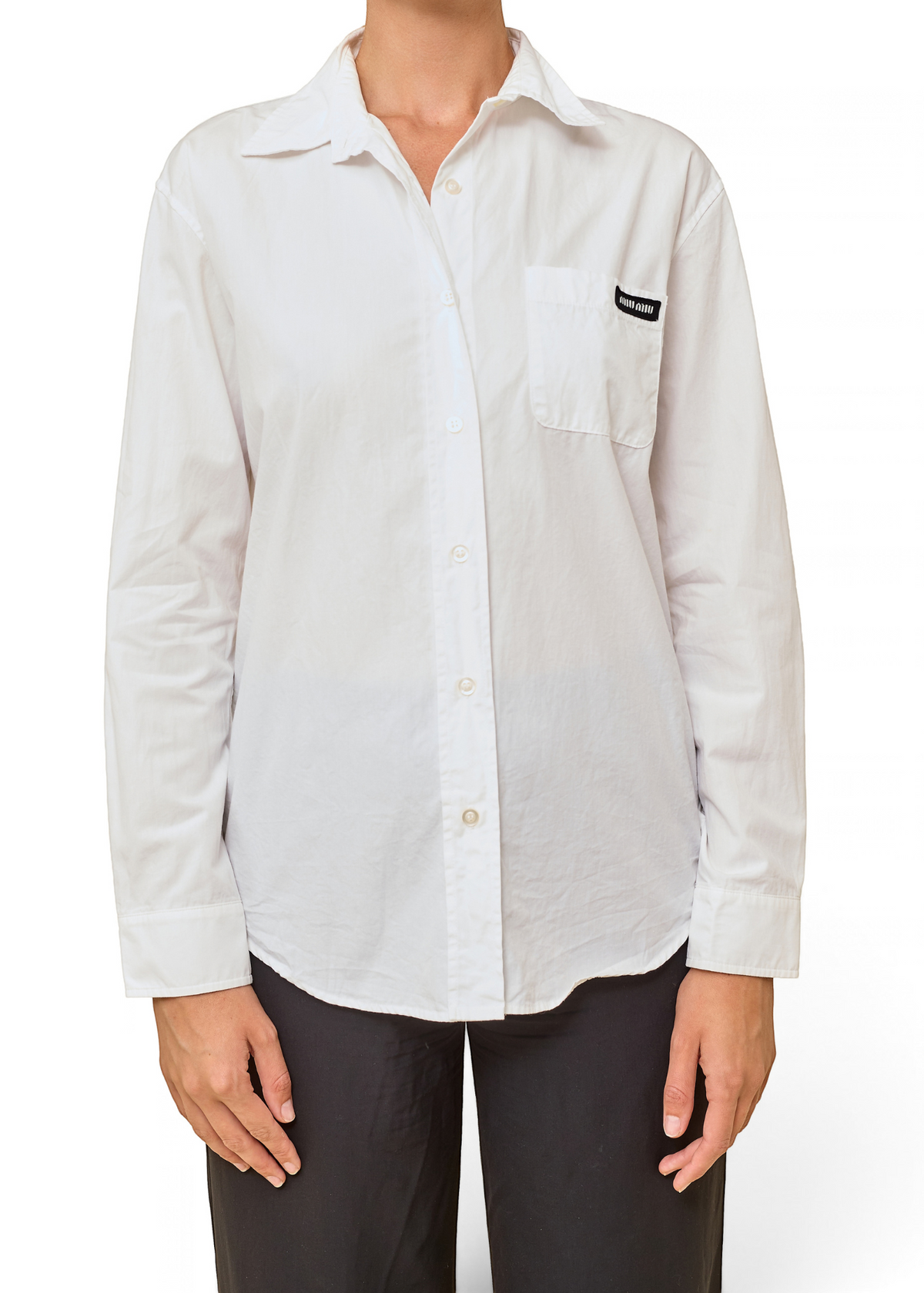 Lost Labels Miu Miu white button-down blouse with a chest pocket and black logo patch, worn by a model.