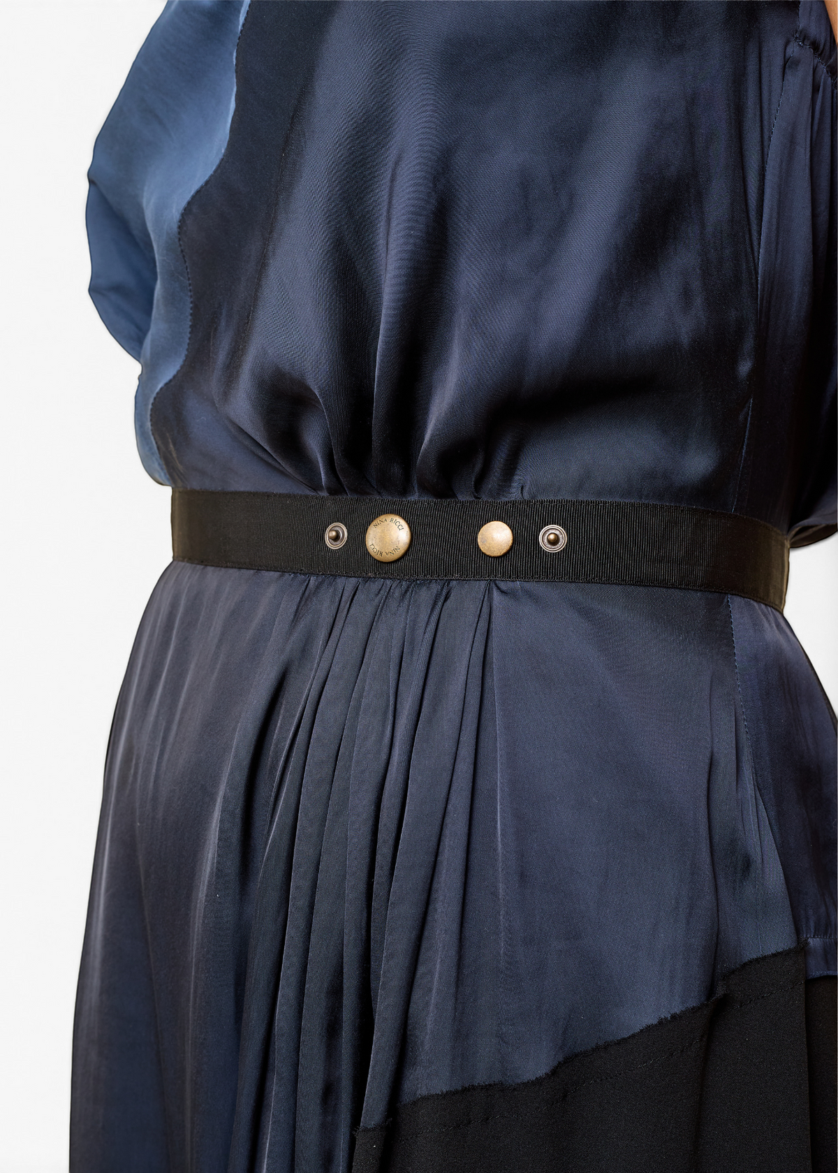 Lost Labels Nina Ricci navy silk dress featuring a fluid drape and a black elasticated waist belt with metal buttons.