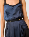 Lost Labels Nina Ricci silk dress in navy blue and black with a fluid drape and button-detail waist belt.