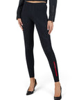Lost Labels Prada black ribbed tights featuring a red logo stripe on the lower leg, worn with black heels.