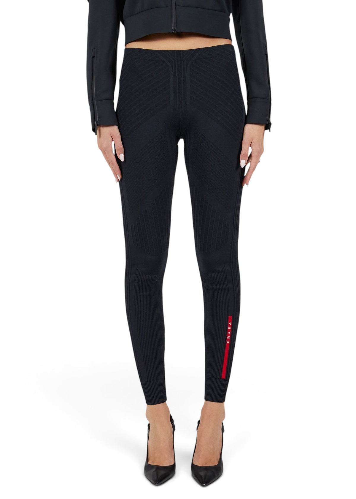 Lost Labels Prada black ribbed tights featuring a signature red logo stripe on the lower leg.
