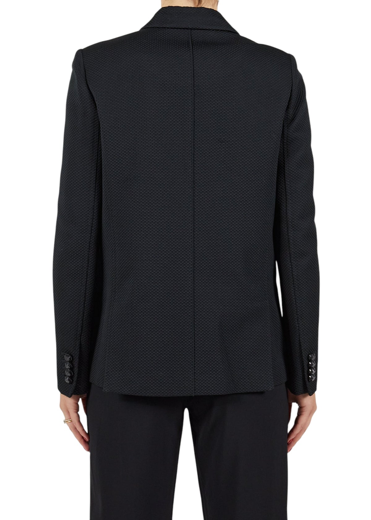 Back view of a Lost Labels Proenza Schouler black double-breasted blazer in a textured wool blend fabric.