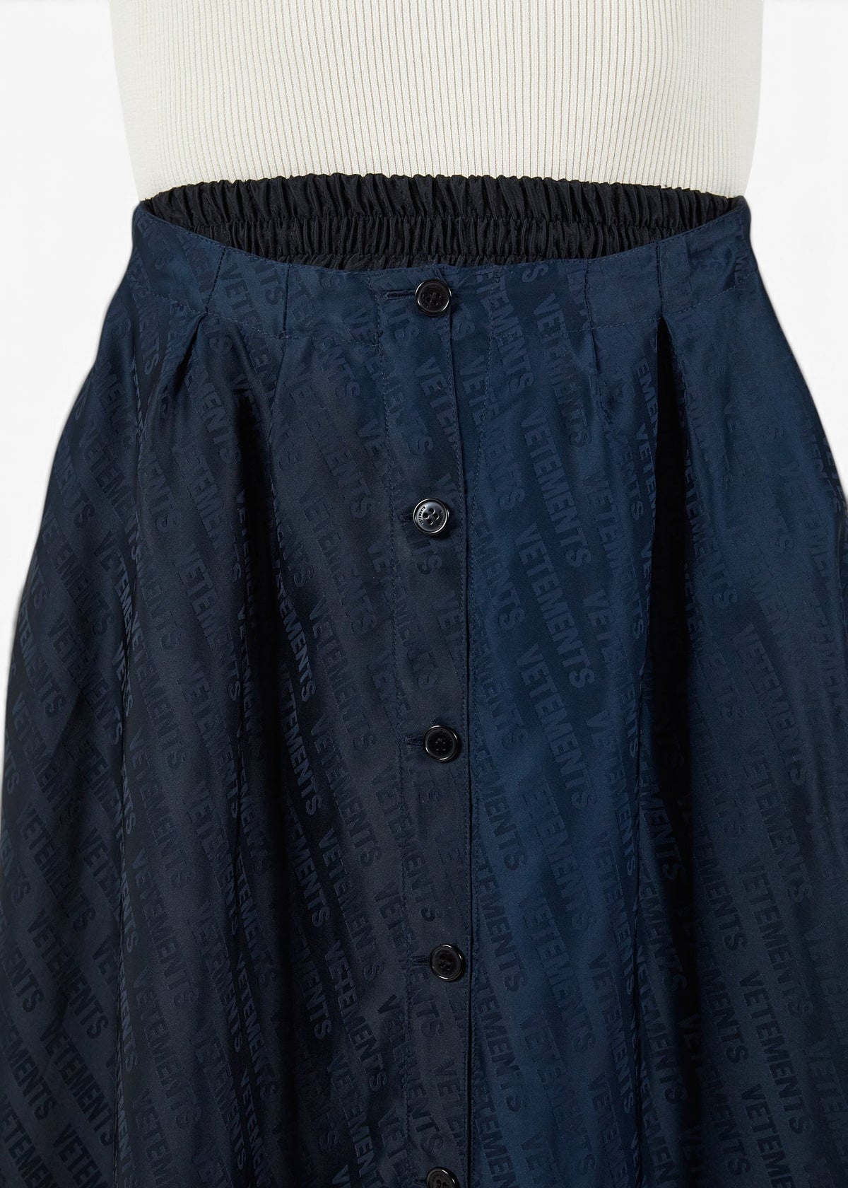 Lost Labels Vetements reversible skirt in navy and black with an all-over logo print and button-down front