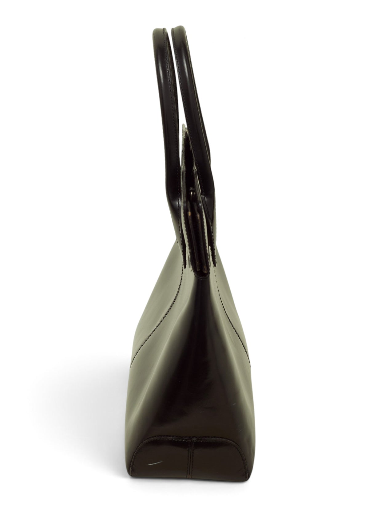 Lost Labels vintage Tod's black leather handbag, side profile view showing structured design and dual handles.